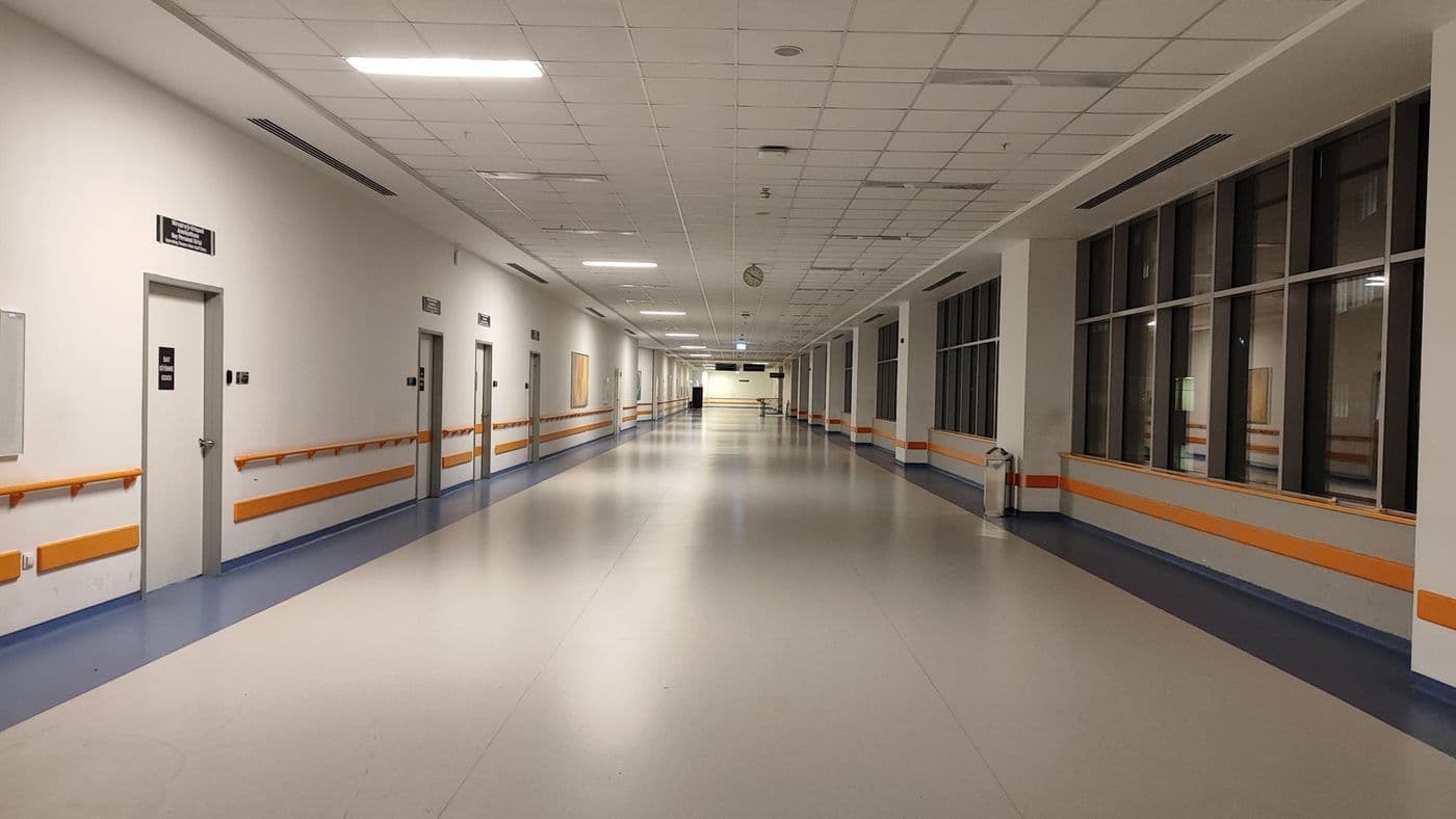 Bright modern healthcare corridor with integrated building systems